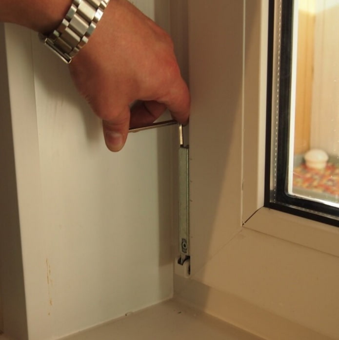 adjustment of the bottom hinge of the pvc window