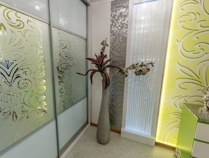 tall drop-shaped vase with volumetric filling in the form of knitted flowers