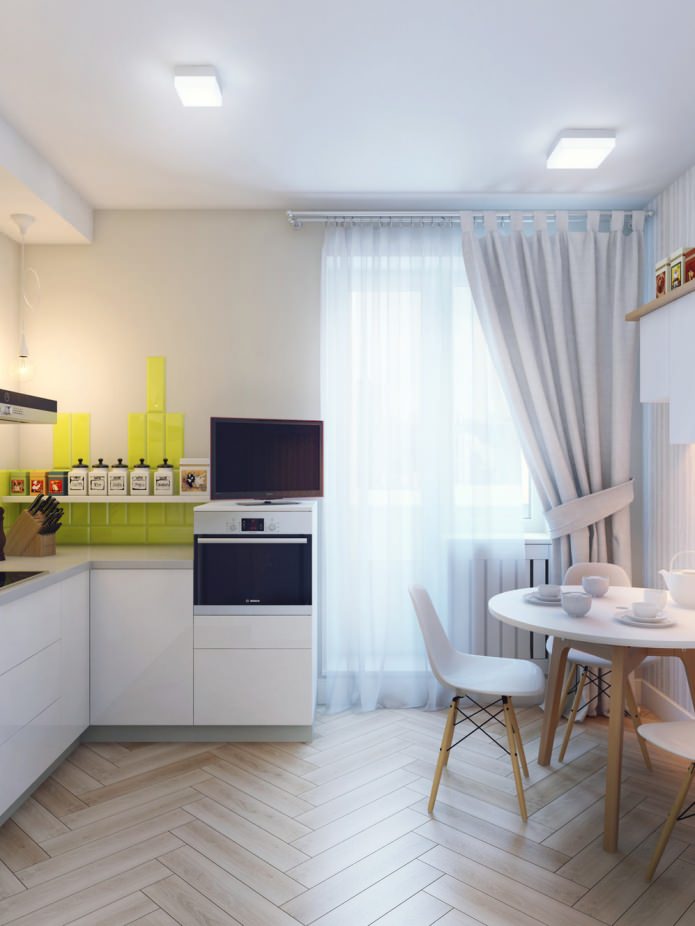 kitchen in the interior design of a 1-room apartment of 37 sq. m.