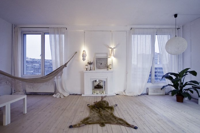 white false fireplace in the interior of the living room white false fireplace in the interior of the living room