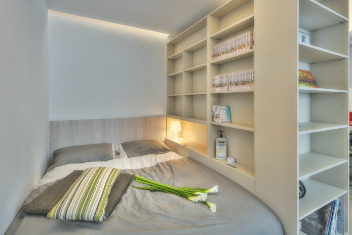 bedroom in the design of a studio apartment of 32 sq. m. bedroom in the design of a studio apartment of 32 sq. m.
