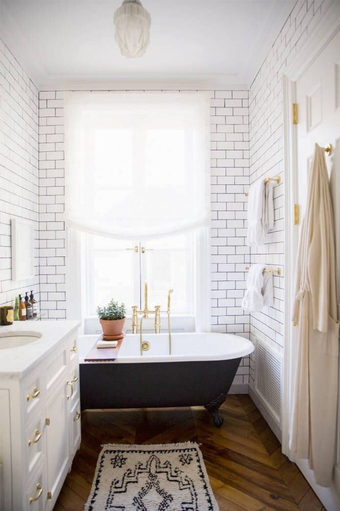 white brick in the interior of the bathroom