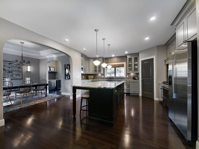 The door and the floor are dark, the skirting is light