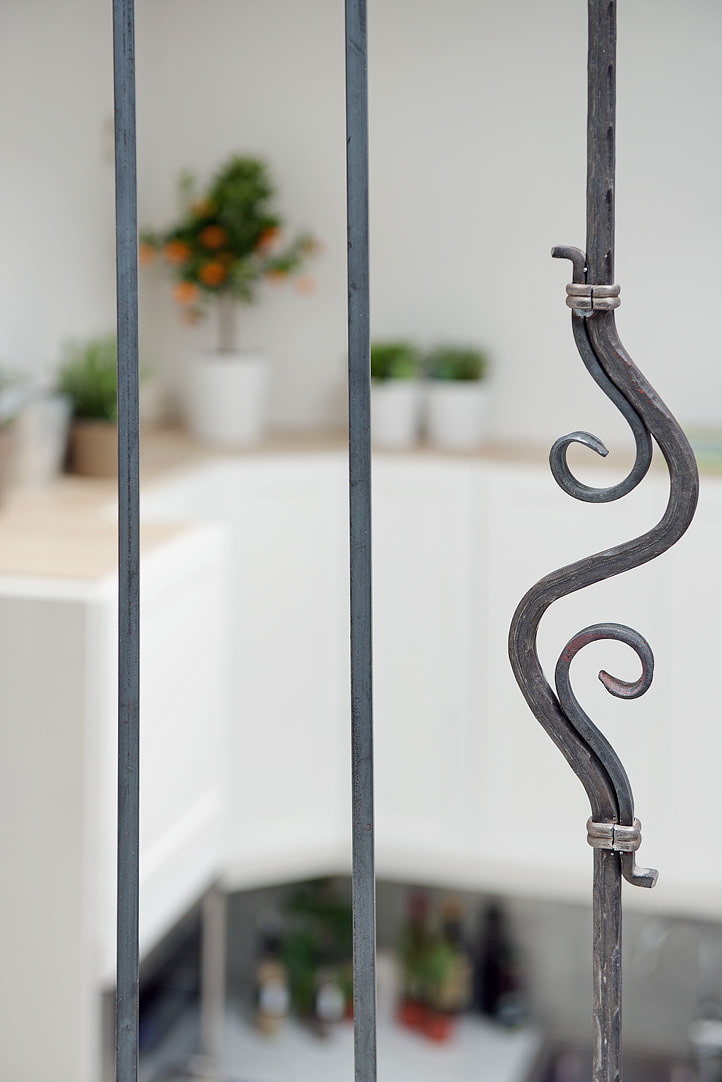 forged railings in a mansard-type apartment forged railings in a mansard-type apartment