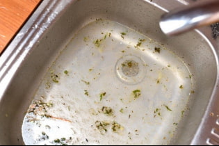 How do I clear a blockage in my sink?